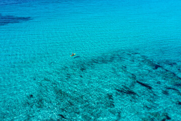 Aerial views with drone filming people kayaking off the coast of Europe.