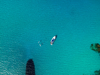 aerial imagery 4k of land and sea with boats