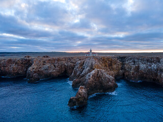 4k drone aerial views of the Punta Nati lighthouse in the Balearic archipelago, off the coast of Europe.