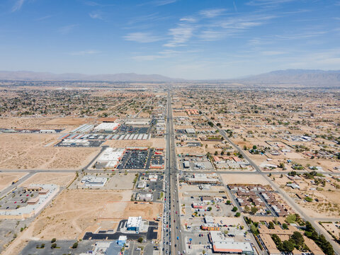 Victorville, California – April 15, 2021: Aerial Drone View Of Victorville Above Bear Valley Rd With Shopping Malls, Commercial Buildings, Vacant Lands.