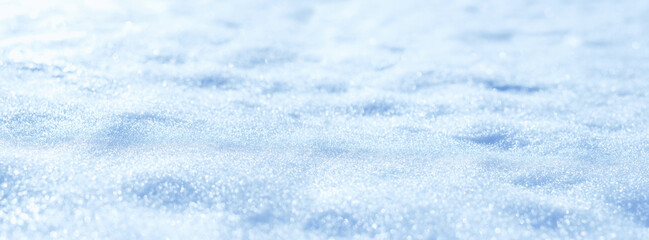 Obraz premium Abstract natural winter snow background. blue-white beautiful snowflakes surface macro shot. winter season. Texture for design. selective focus. banner