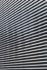 Gray corrugated metal wall up close, abstract, background in Minnesota, USA.
