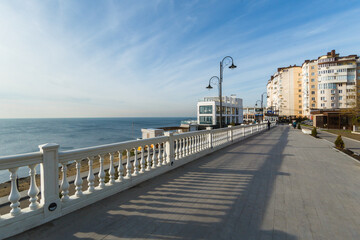 Fototapeta premium apartment house on the embankment overlooking the sea resort town