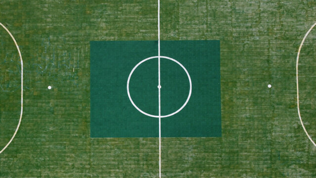Aerial view with drone of floating green football field. Ko Panyi, Thailand, Asia. Copy space.
