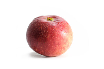 Fresh organic red apple with visible blossom and water drops on the skin, isolated with shadow on a white background, copy space