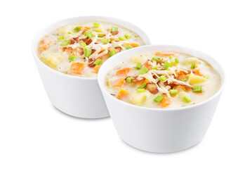 Fresh hot chowder soup with fried bacon slices and shredded cheese in a bowl on a white isolated background
