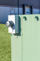 Electric Meter On Power Box Outside Commercial Warehouse Vertical