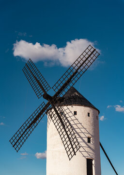 Old windmill with blue sky and cloud