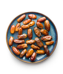 Dried dates fruit on plate isolated on white background.