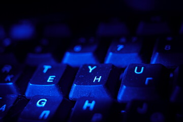 computer keyboard at night blue light