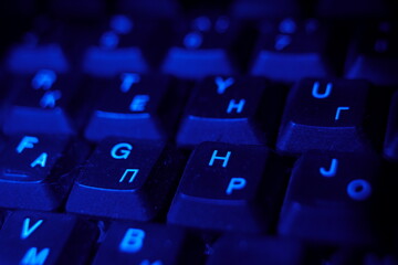 computer keyboard at night blue light