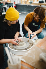 Class on modeling of clay on a potter's wheel In a ceramic workshop