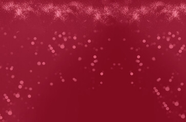 Festive background in shades of magenta with golden sparkles. Atmospheric mood of the Year 2023. 