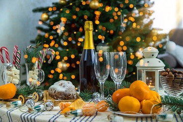 Champagne on the Christmas table. Selective focus.