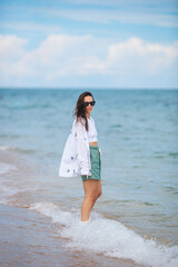 Young happy woman on the beach. 