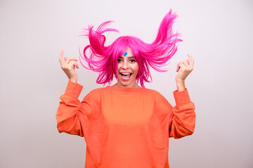 Portrait of a joyful woman with pink hair