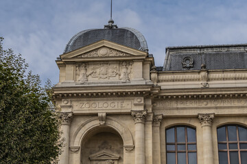 Obraz premium Architectural details of old Paris buildings: “Grand Gallery of the Evolution” - imposing Renaissance-revival building, built in 1889. Paris. France.
