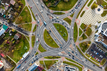 aerial view of road interchange or highway intersection. Junction network of transportation taken by drone. - obrazy, fototapety, plakaty