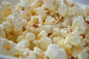 Popcorn background, Sweet popcorn top view, Tasty heap of salted popped popcorn