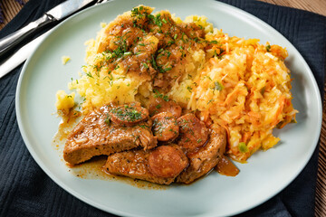 Stewed turkey meat with chorizo sausage.