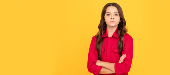 confident and serious teenager girl in red shirt crossed hands, confidence. Child face, horizontal poster, teenager girl isolated portrait, banner with copy space.