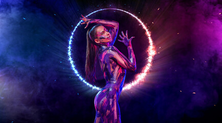 Woman in neon lights. Portrait of sexy dancer at club party. Body art with bodypaint