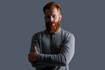 Confident bearded guy. Irish guy with red beard and moustache. Serious unshaven guy