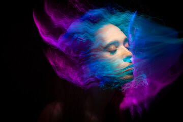 Obraz premium Abstract photography in the style of light painting. girl on a black background