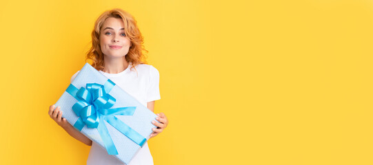 smiling redhead lady with giftbox. mothers day. Beauty woman isolated face portrait, banner with mock up copy space.