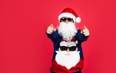 Ho Ho Ho. happy new year. merry christmas. cheerful bearded man in santa claus hat and sweater. brutal hipster celebrate xmas party. winter holiday preparations. present and gift shopping sale