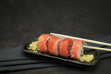 A set of delicious sushi on dark background
