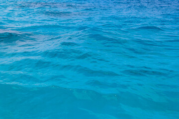 Fototapeta na wymiar Blue water texture background. Surface of sea or ocean