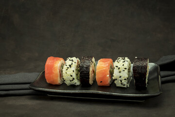 A set of delicious sushi on dark background