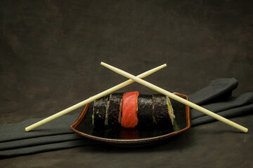 A set of delicious sushi on dark background