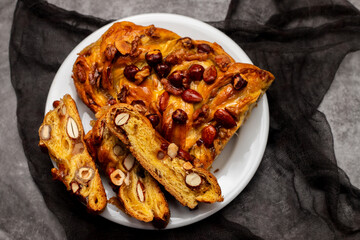 typical portuguese fruit cake Bolo rainha on plate