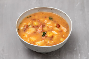 Sopa de pedra Portuguese Stone Soup with beans and sausages in the plate