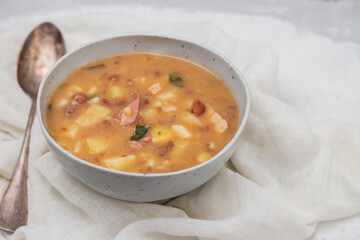 Sopa de pedra Portuguese Stone Soup with beans and sausages in the plate