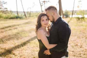Young couple in love walking in the park