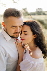Fototapeta premium Young couple in love walking in the park