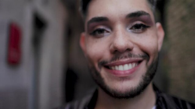 Gay transgender person wearing makeup smiling outdoor - LGBTQ nonbinary concept