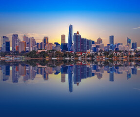 Sydney Harbour Australia at Sunset with the reflection of the Buildings and high rise offices of...