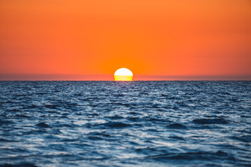 Atmospheric refraction flattens the sun at sunset.