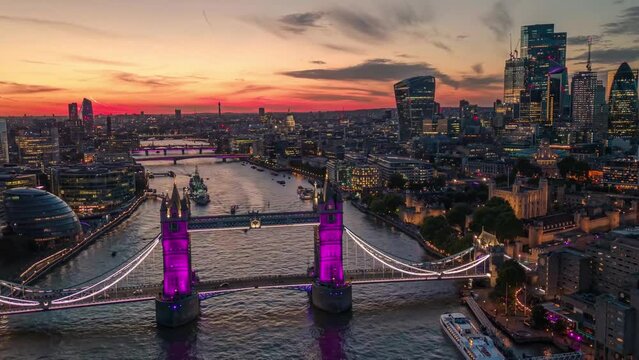 Establishing Aerial Drone Helicopter View Of Tower Bridge City of London Skyline The Shard And Thames River Purple Illuminated Hyper-lapse Time Lapse View Of London Skyscraper UK, United Kingdom
