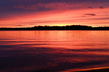 Fototapeta na wymiar Dusk on a lake with evening clouds 3