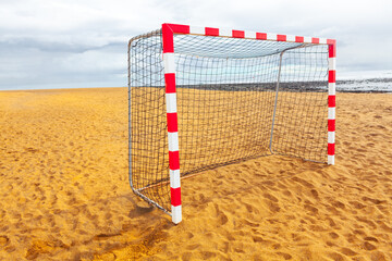 Beach soccer goal . Sandy beach with football gate 