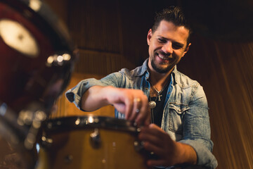 Young man musician with drums. High quality photo