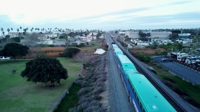 A NCTD Coaster Train Headed South At Buccaneer Park in Oceanside California