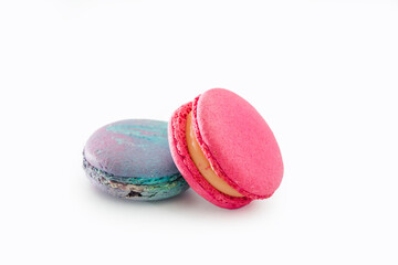Sweet colorful macarons isolated on white background. Tasty colourful macaroons. Two multi-colored blue and pink macaroons. French pastry made from egg whites.