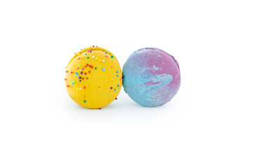 Sweet colorful macarons isolated on white background. Tasty colourful macaroons. Two multi-colored blue and yellow macaroons. French pastry made from egg whites.