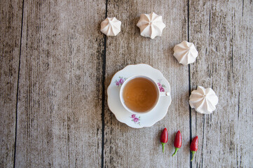 vintage tea cup with meringues around